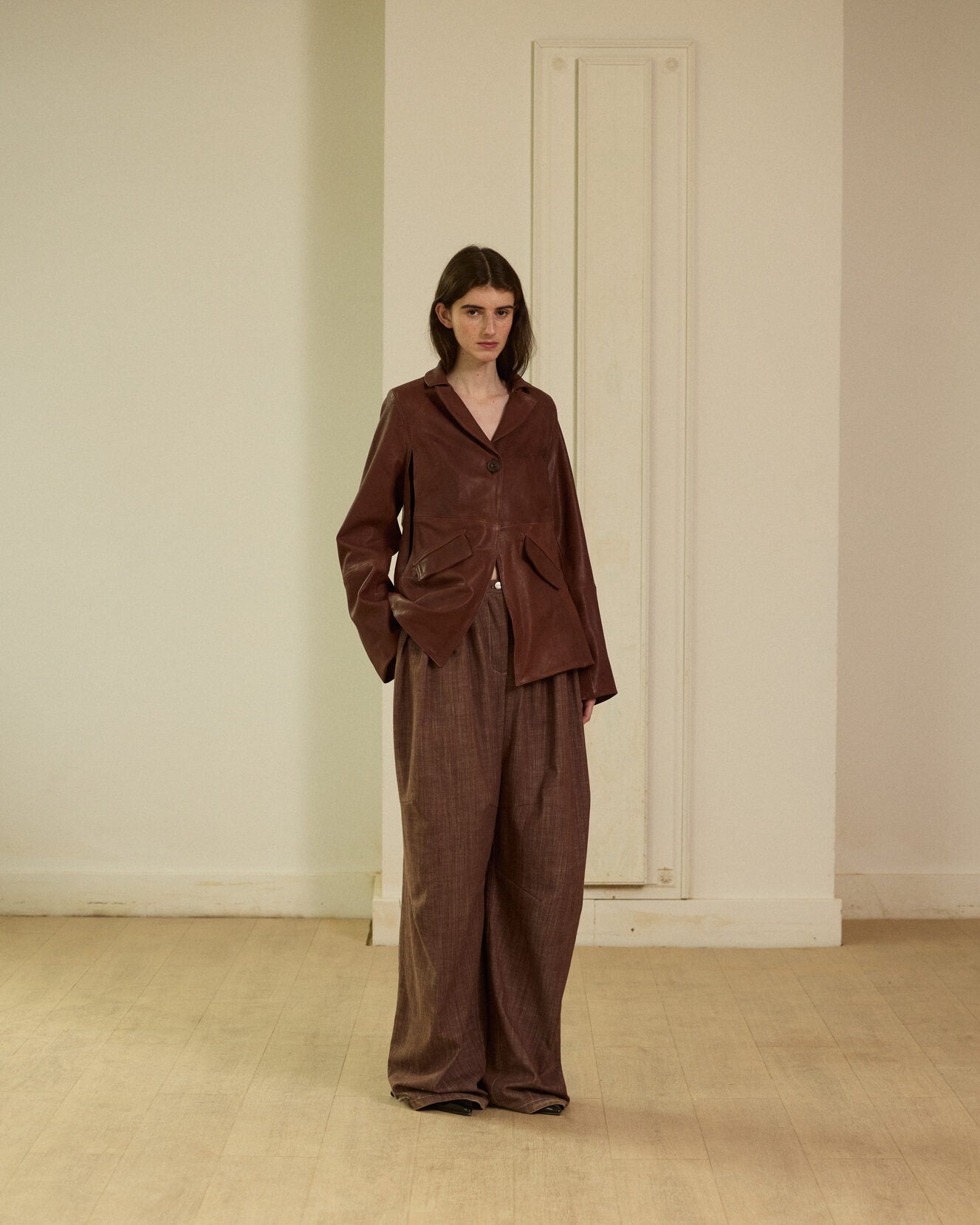 Brown leather blazer with armholes in the front