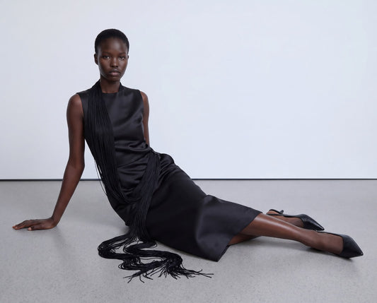 Straight-cut black dress with long fringes