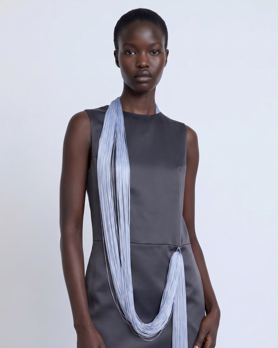 Straight-cut grey dress with long blue fringes